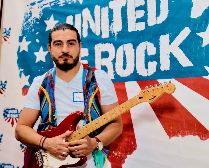 Nico with a Fender Stratocaster at United We Rock