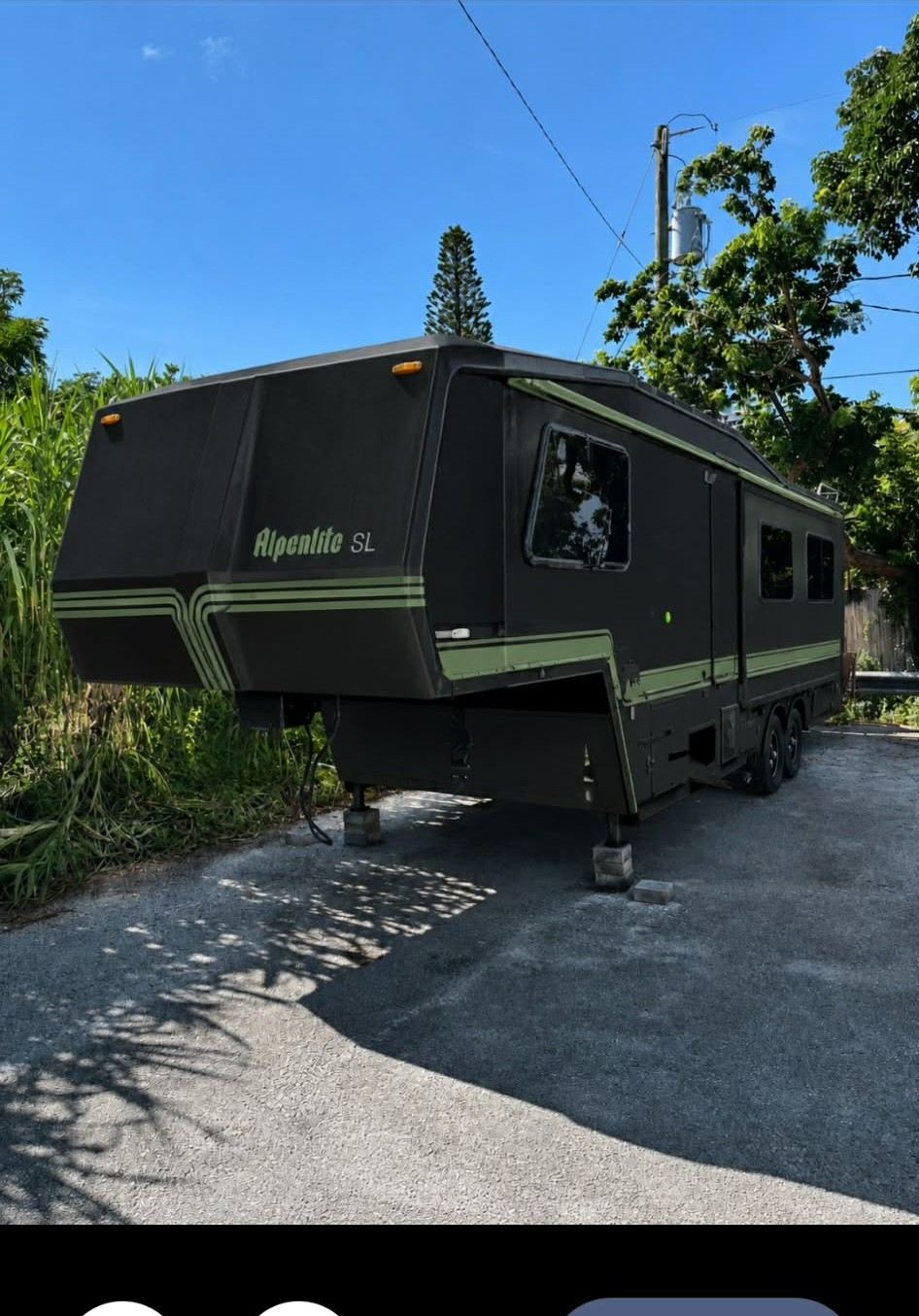 The Alpenlite fifth wheel rebuilt in black with green accents