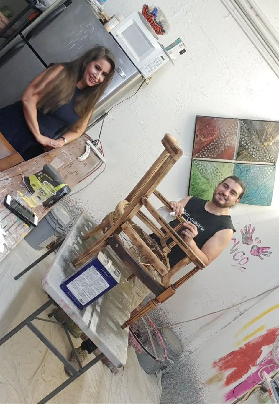 Nico stripping a chair frame in the studio
